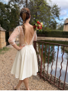 Une robe de mariée courte en tulle brodé , robe civile grand dos nu, création française