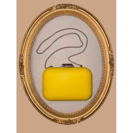 Sac de soirée à porter à la main ou en bandoulière. Jaune et argenté, très chic, en simili-cuir.