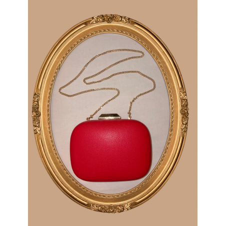 Sac de soirée à porter à la main ou en bandoulière. Rouge et doré, très chic, en simili-cuir.